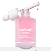 Medicube Ultra Light PDRN Pink Peptide Serum in a frosted pink bottle with a white dropper cap and a pink dropper resting across the open neck, on a white background.