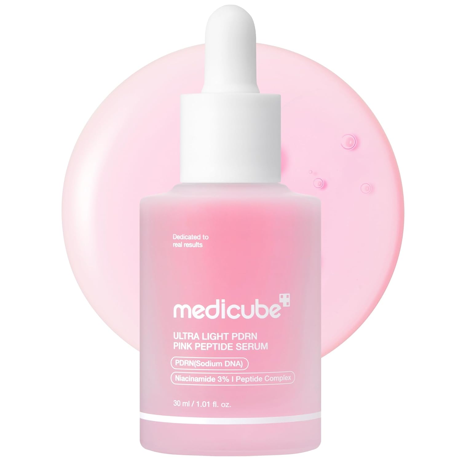 Pink skincare serum bottle with dropper labeled 'medicube' on a white background