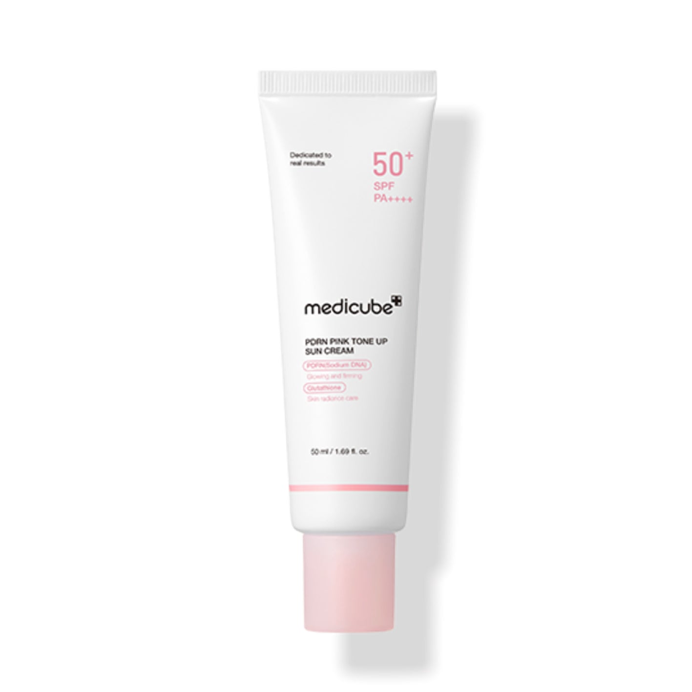 Medicube pink tone up sun cream tube on a white background