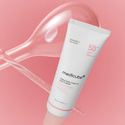 Tube of Medicube sun cream on a pink background