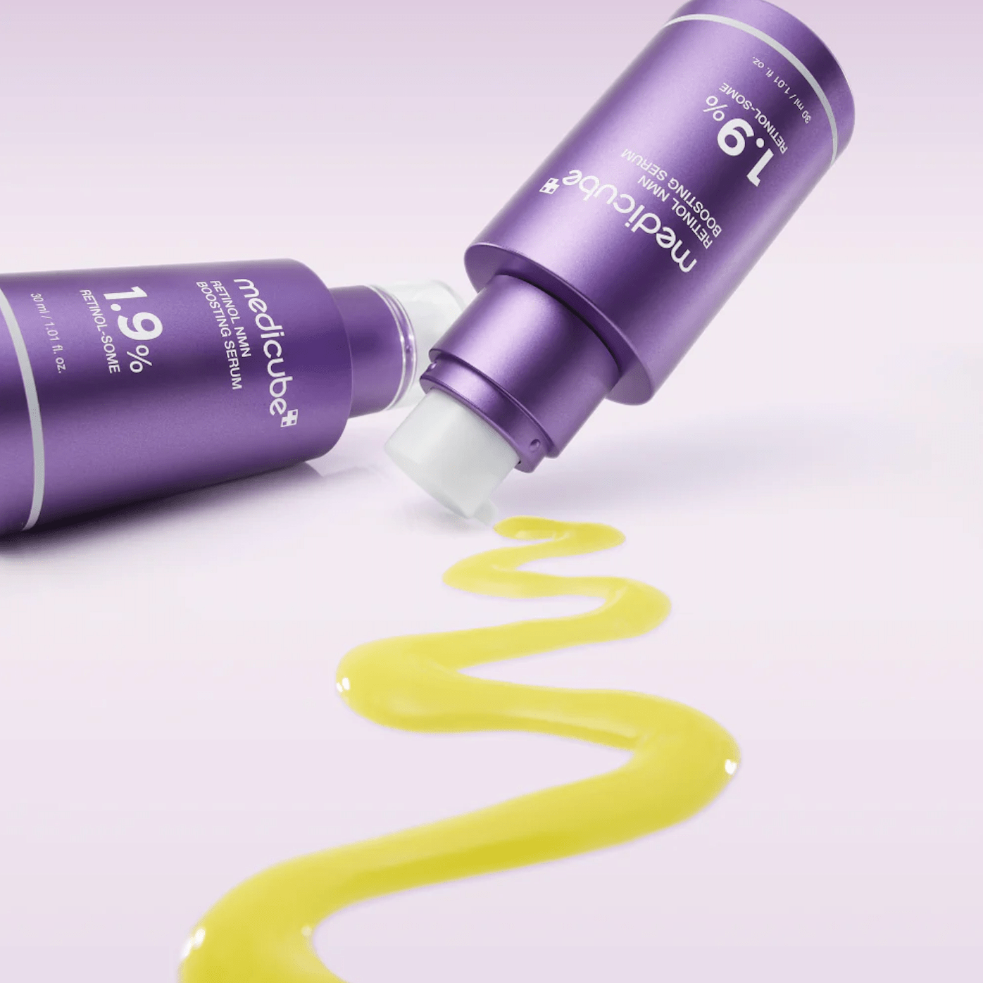 MEDICUBE Retinol NMN Boosting Serum with yellow liquid on a white background