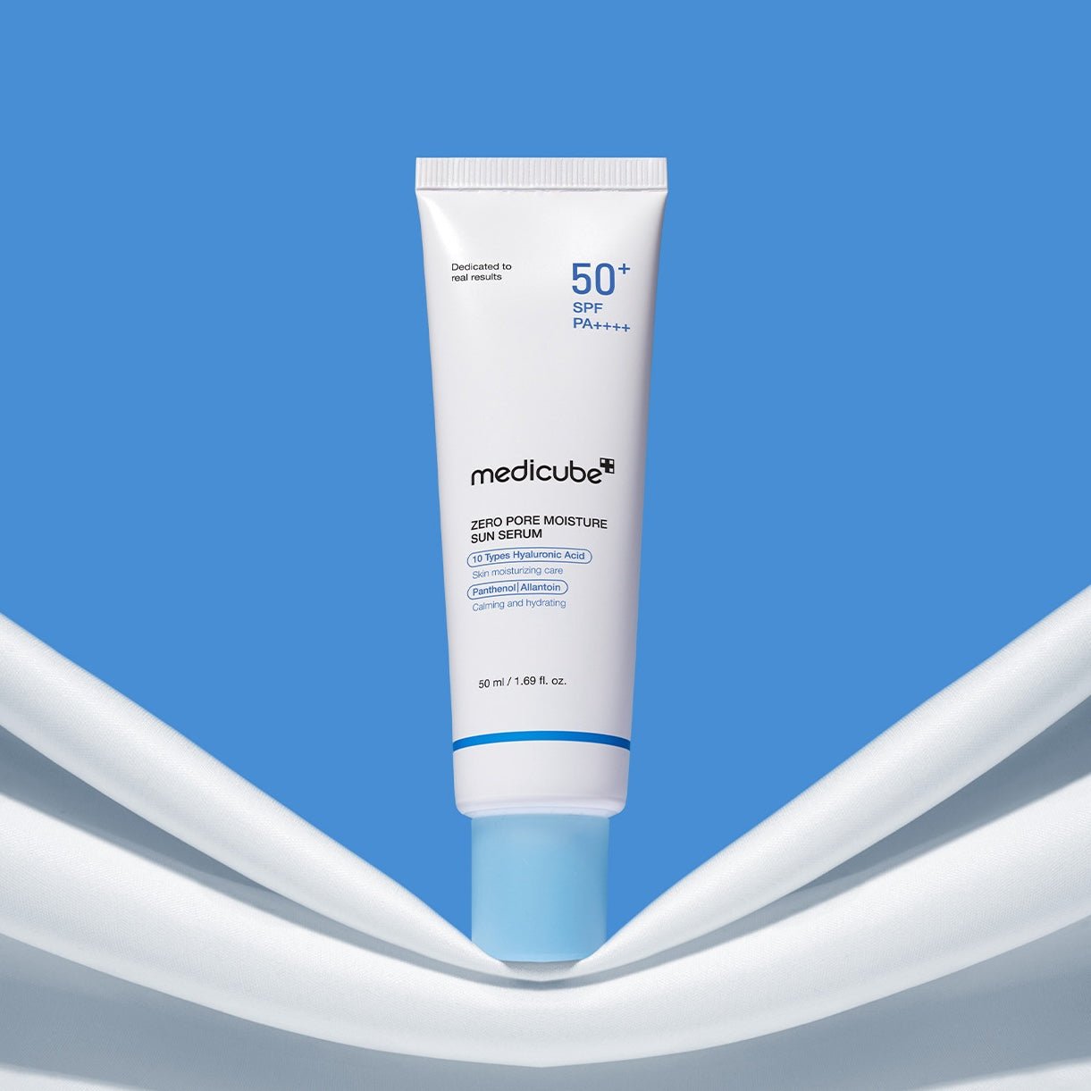 Medicube skincare serum tube on a blue and white background