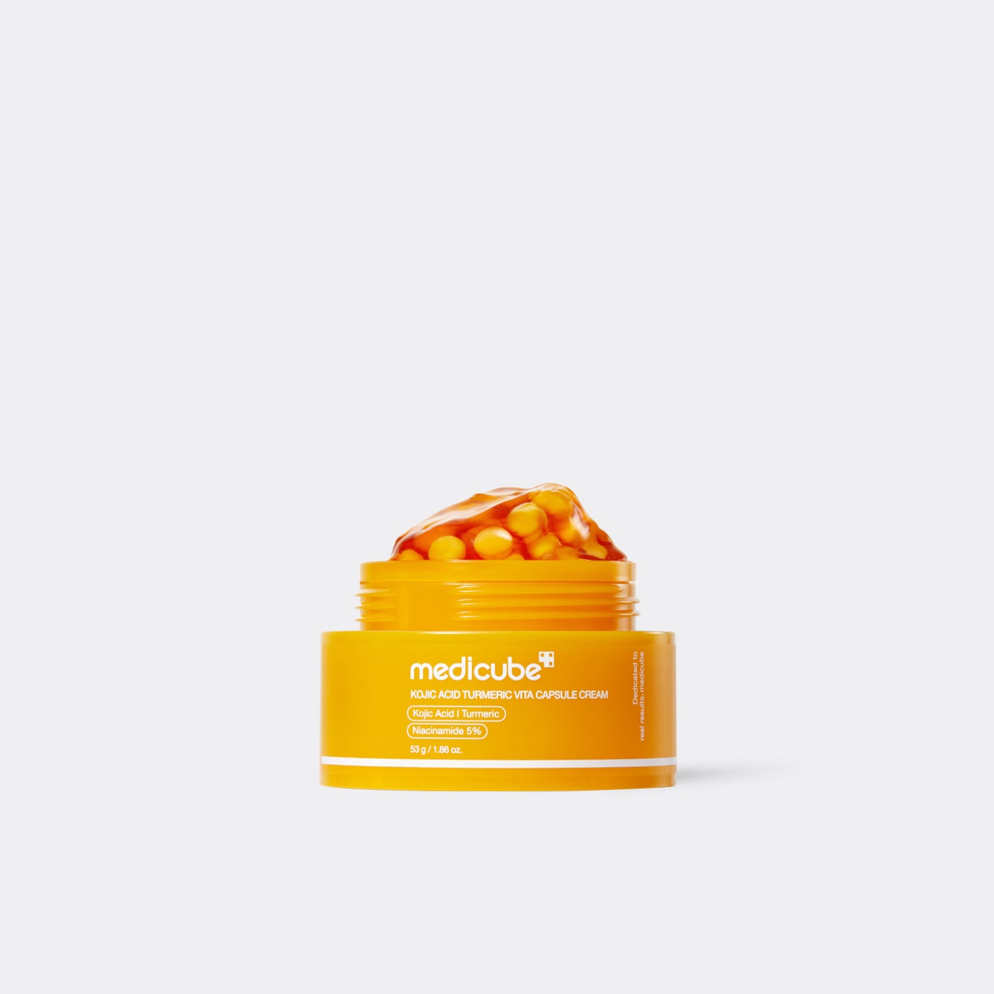 Yellow capsule jar of  Medicube KOJIC ACID TURMERIC VITA CAPSULE CREAM  with a white background