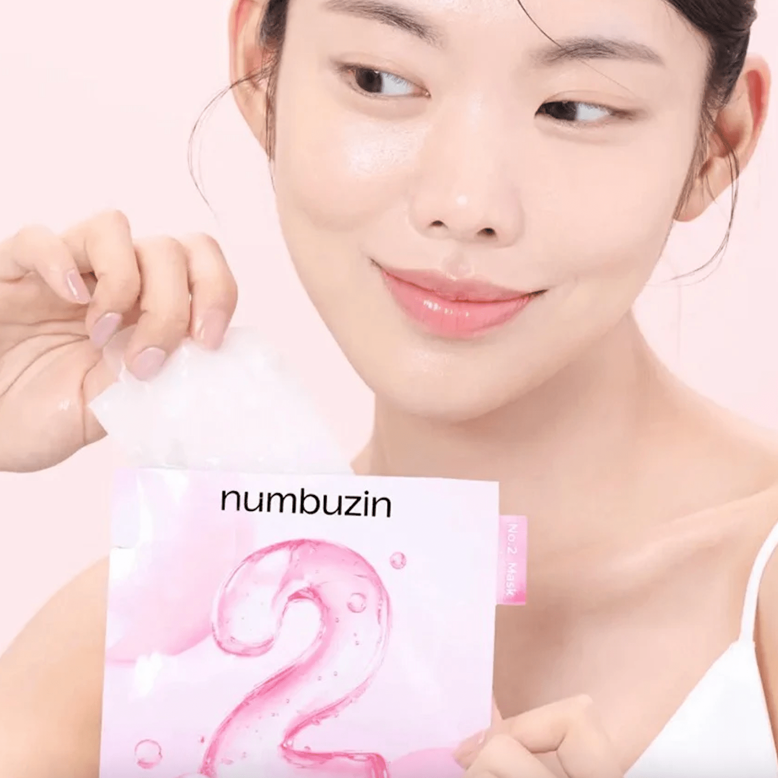 K-beauty model holds NUMBUZIN No.2 Rose PDRN Collagen Plumping Mask