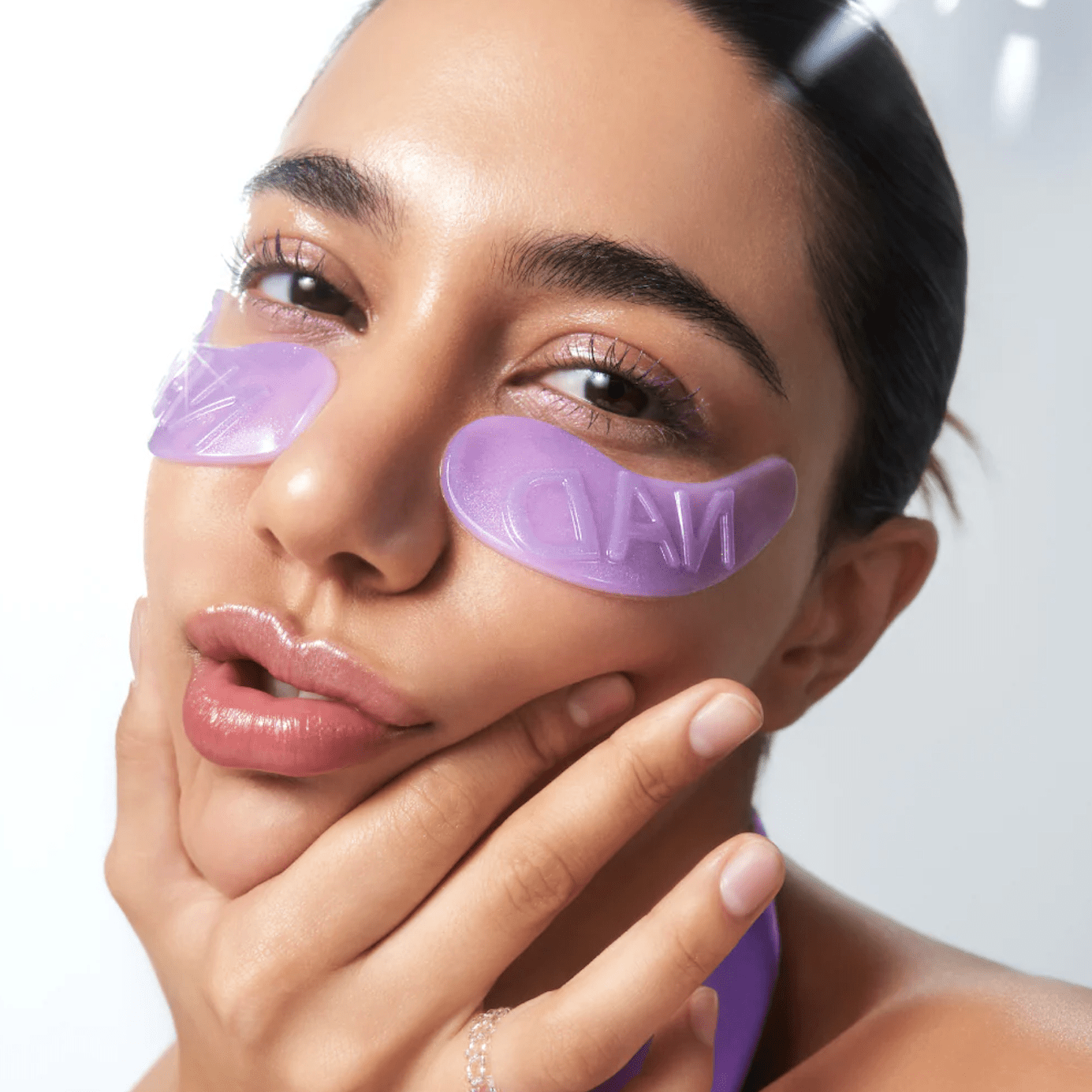 Model face close shot with  NUMBUZIN No.9 NAD+ Collagen Under Eye Patches (5 Pairs)  under eye