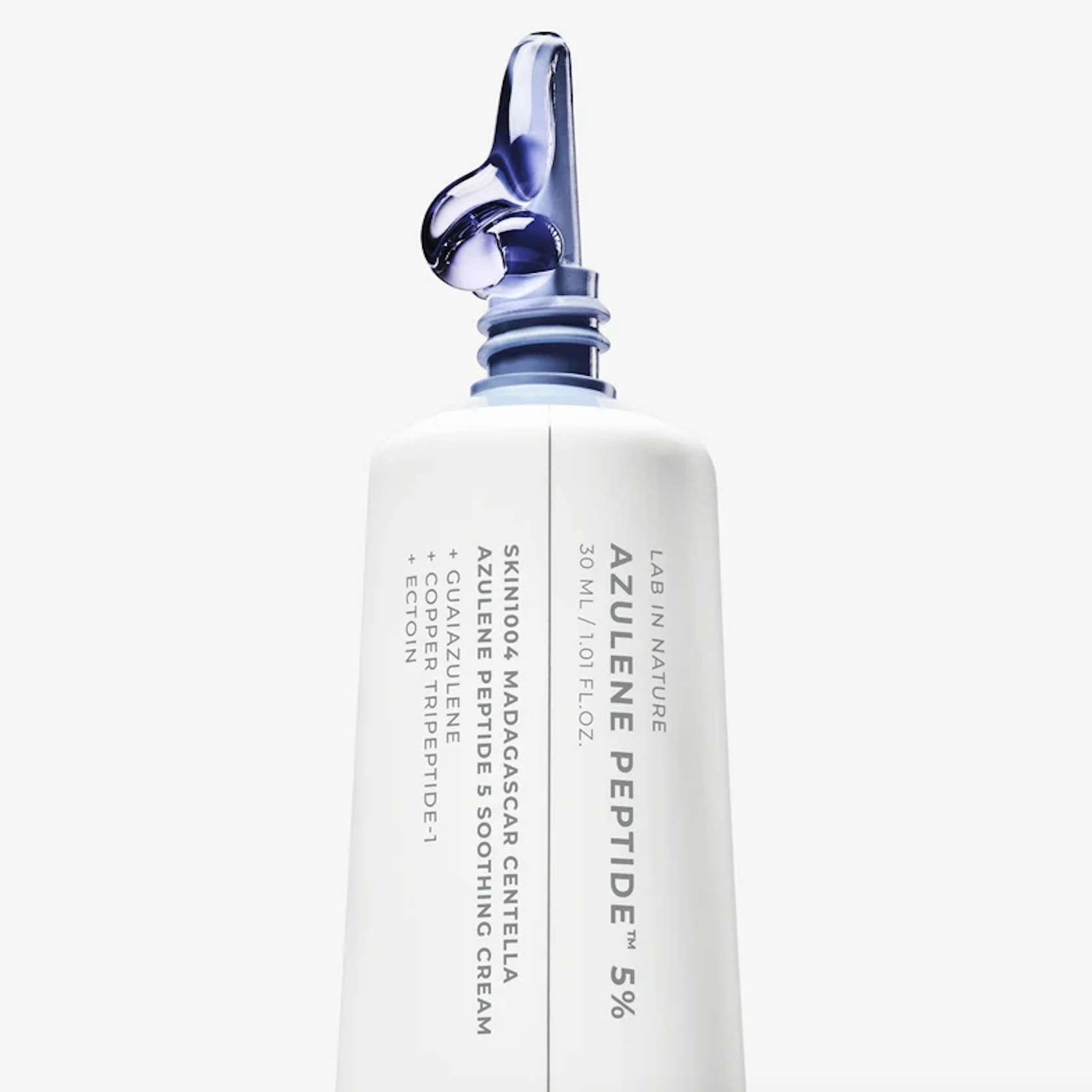 SKIN1004 Madagascar Centella Azulene Peptide 5 Soothing Cream, featuring a distinctive blue and purple silicone dropper cap, set against a clean white background.