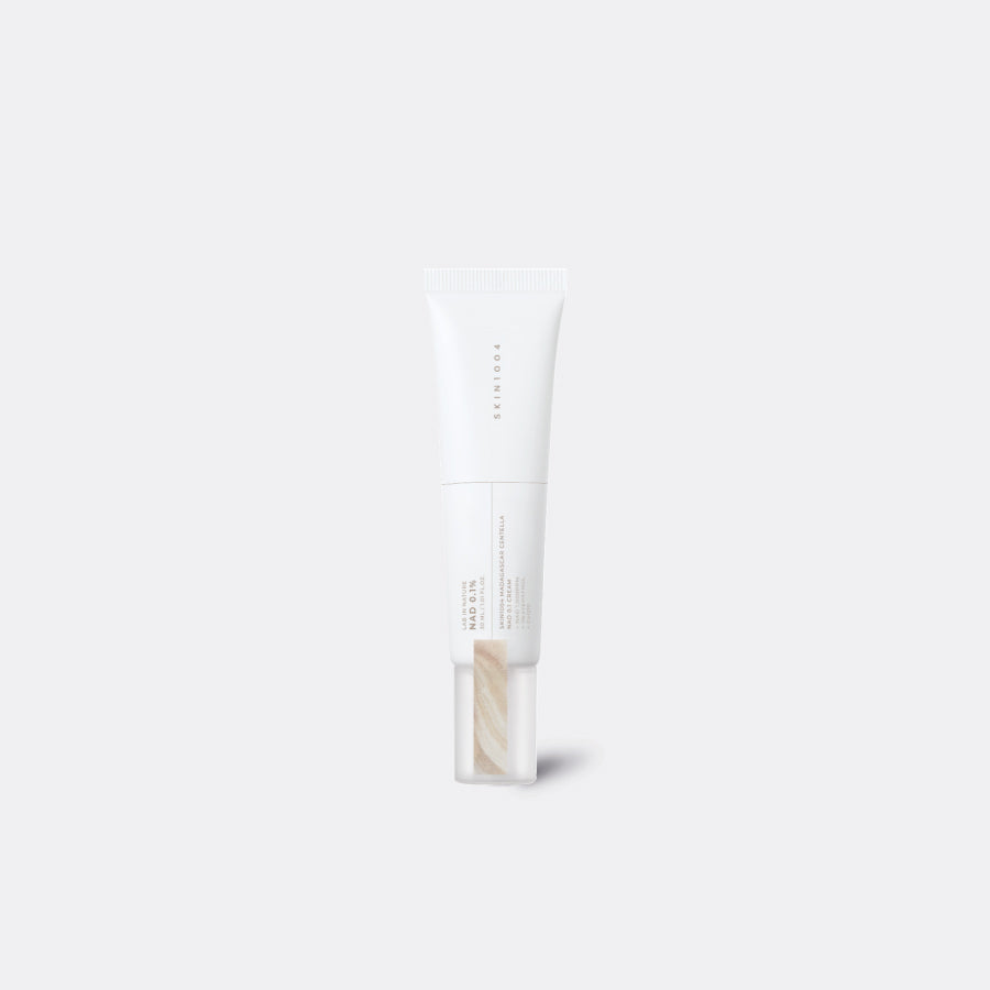 A white squeeze tube of SKIN1004 Madagascar Centella NAD 0.1 Cream White Luminous Dewy Puff concealer, shown against a solid light gray background.