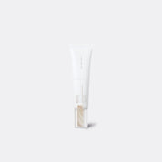 A white squeeze tube of SKIN1004 Madagascar Centella NAD 0.1 Cream White Luminous Dewy Puff concealer, shown against a solid light gray background.