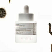 Brightening ampoule: SKIN1004 Niacinamide 10 for reducing dark spots, evening skin tone, and soothing.