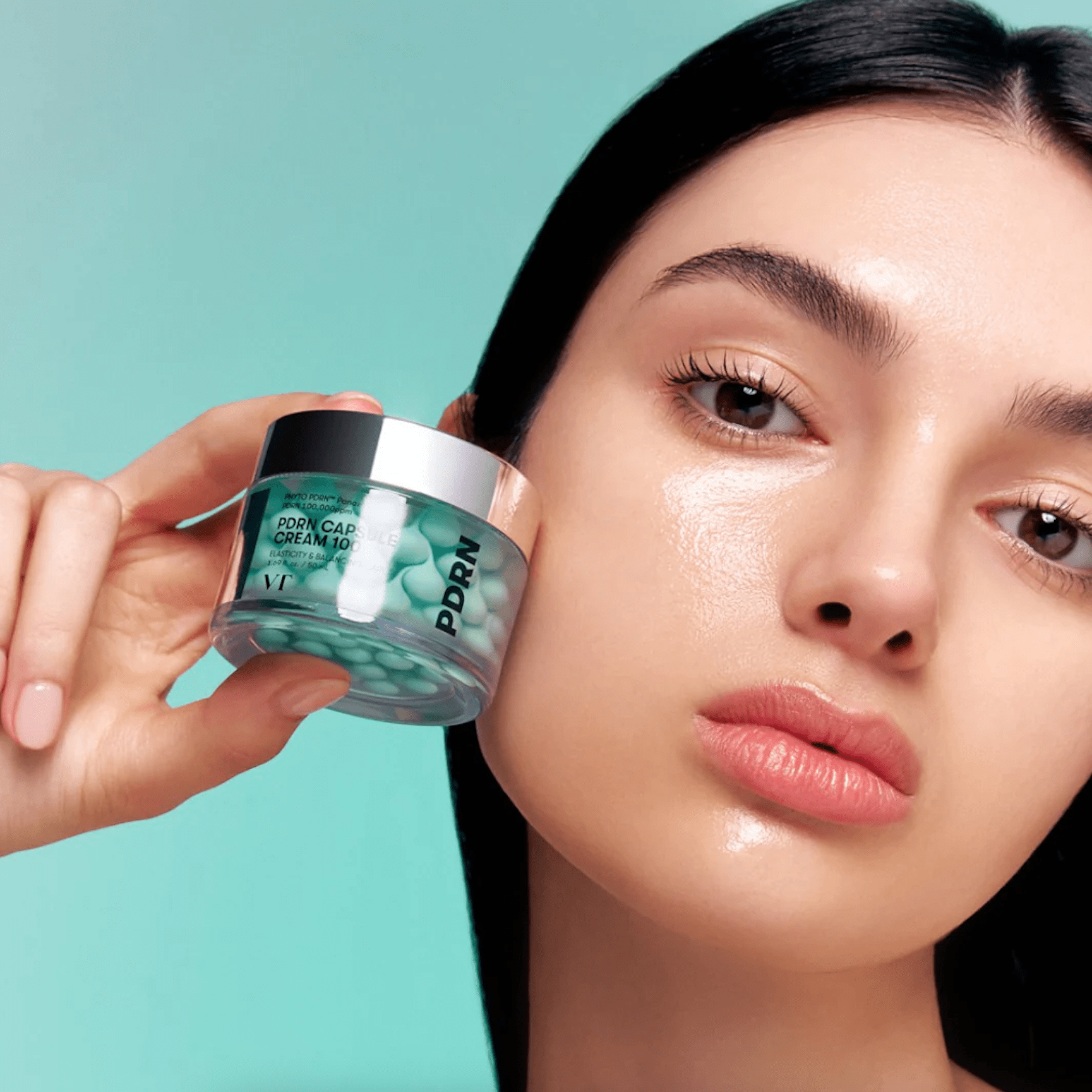 Women holding VT COSMETICS PDRN Capsule Cream 100 jar next face