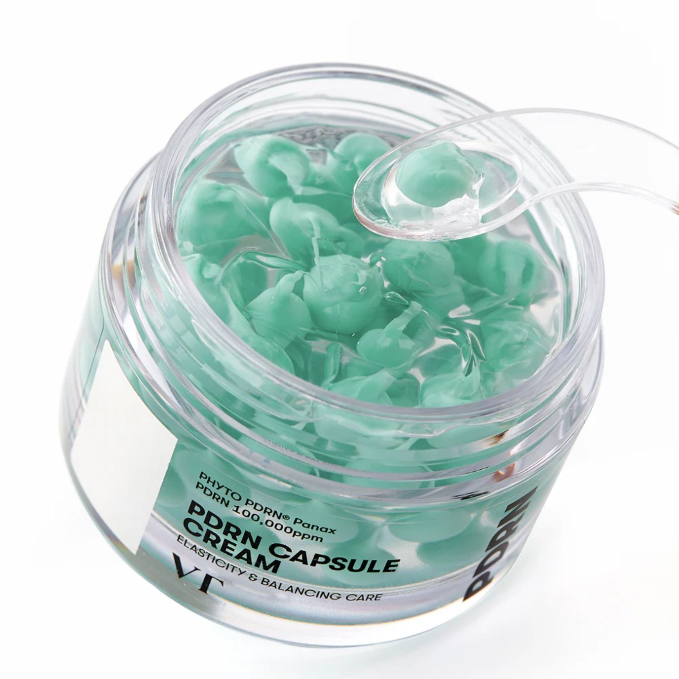 Jar of VT COSMETICS PDRN Capsule Cream 100 with a clear lid on a white background