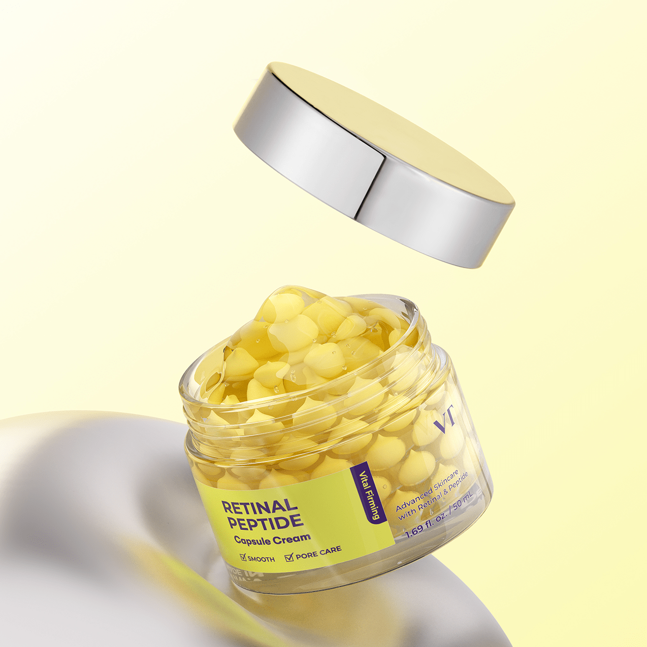 Jar of VT COSMETICS Retinal Peptide Capsule Cream with a yellow lid on a light yellow background