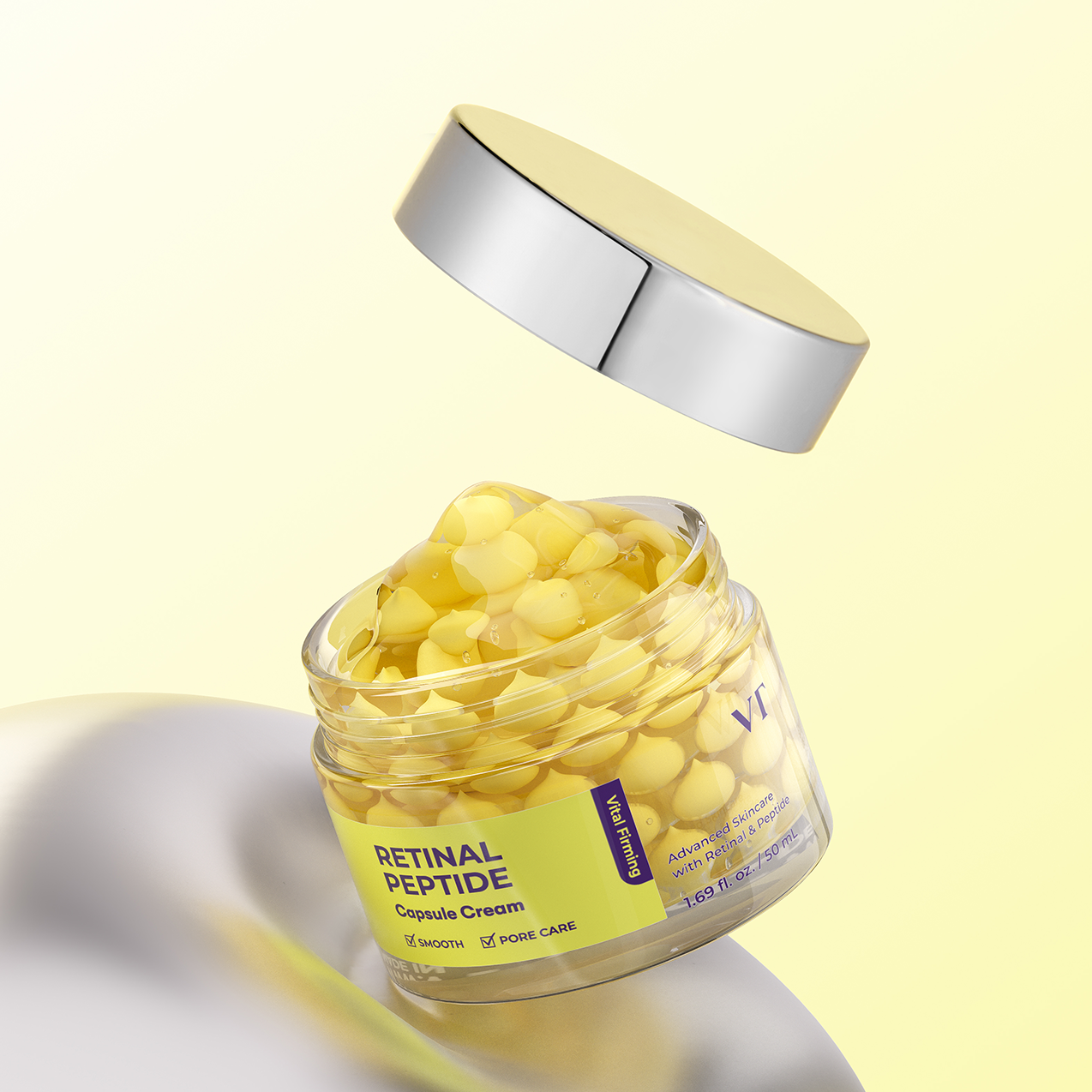 Jar of VT COSMETICS Retinal Peptide Capsule Cream with a yellow lid on a light yellow background