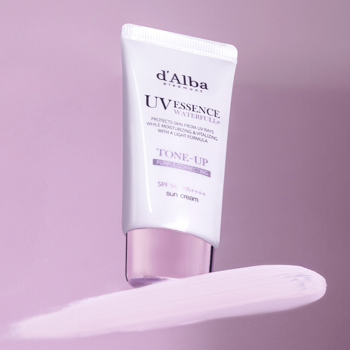 d'Alba UV Essence Tone-Up sun cream tube on a light purple background