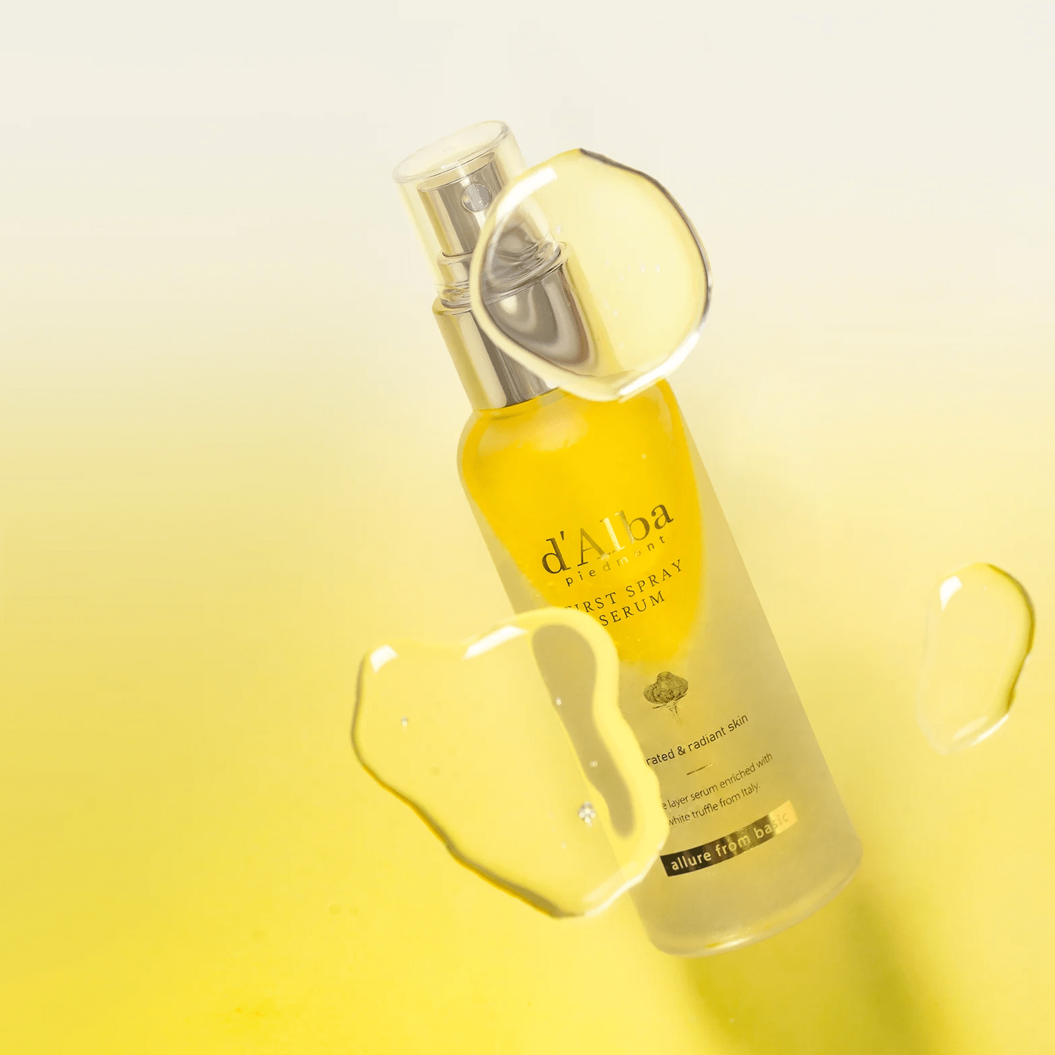 d'Alba White Truffle First Spray Serum  with droplet effect on a yellow gradient background