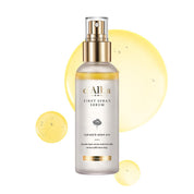 Alba Botanica First Spray Serum bottle with gold cap on a white background