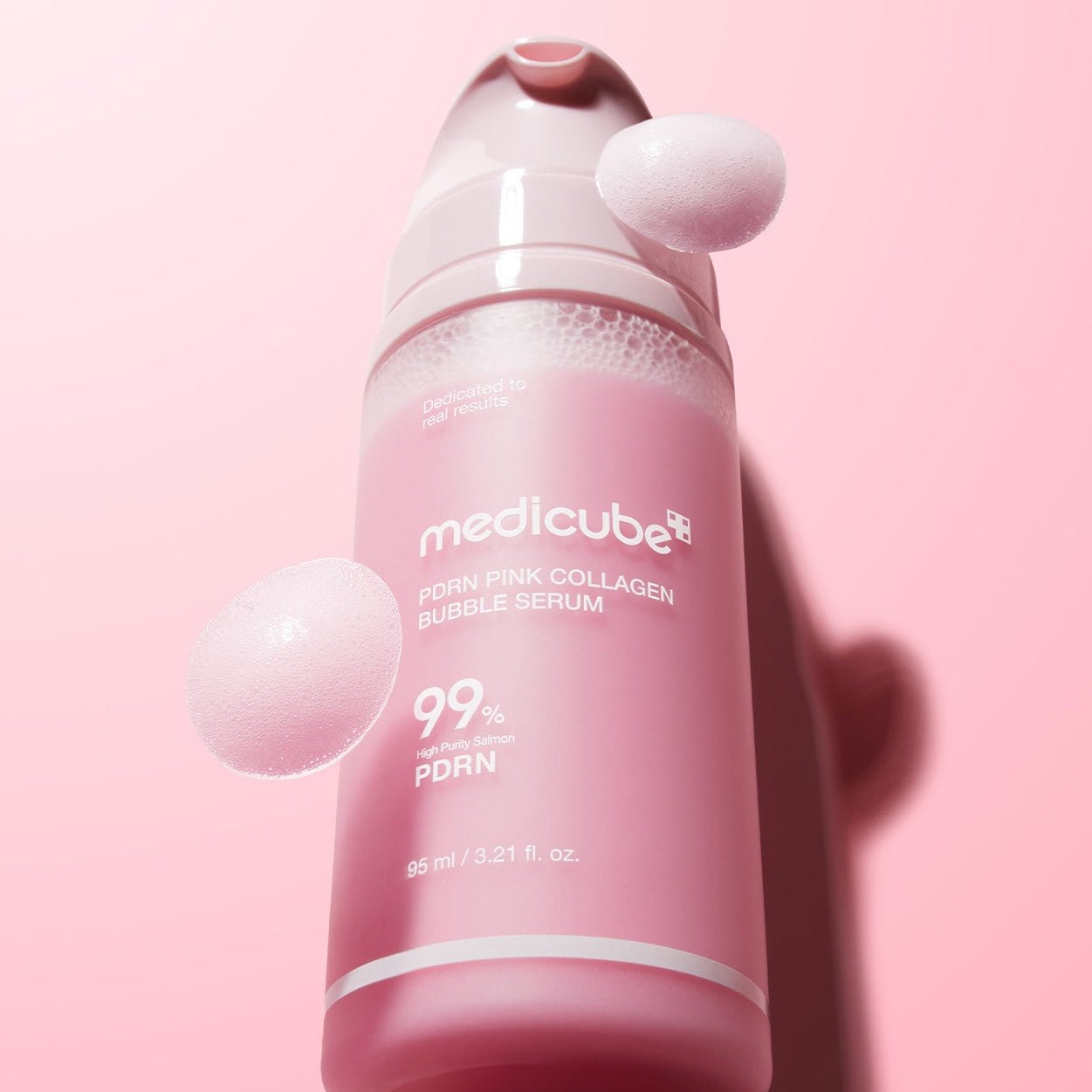 MEDICUBE PDRN Pink Collagen Bubble Serum on pink packground