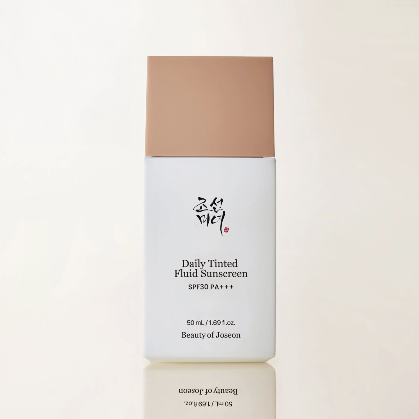 Beauty of Joseon Daily Tinted Fluid Sunscreen bottle on a light beige background