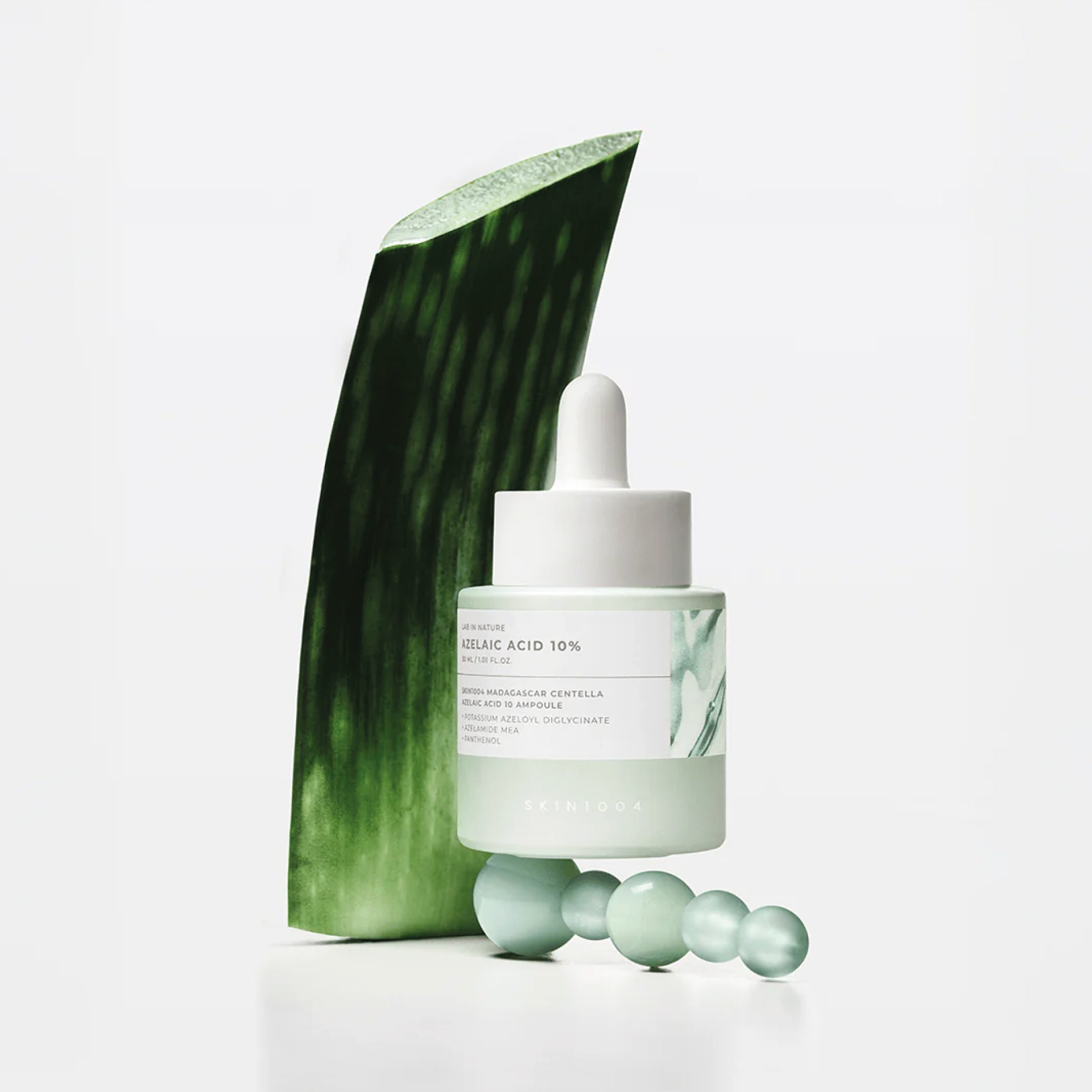 SKIN1004 Madagascar Centella Azelaic Acid 10 Ampoule with aloe vera leaf on a white background